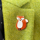 fox brooch on lime green jacket