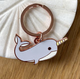 Keychain with a narwhal design on a marble background